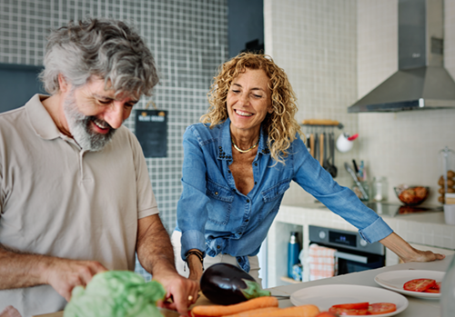Older couple in the kitchen, living with rosacea